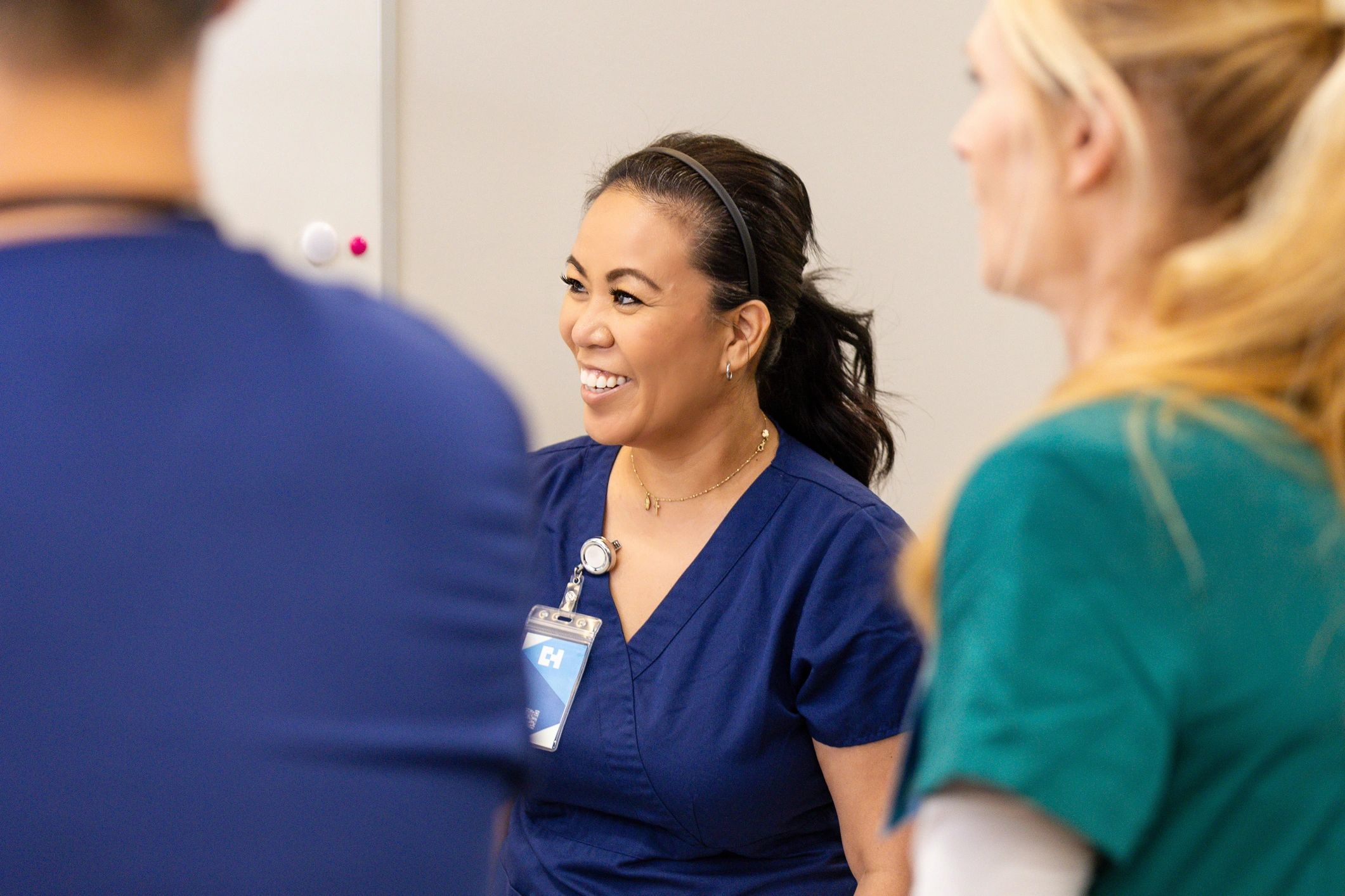 Nurse listening during a staff meeting