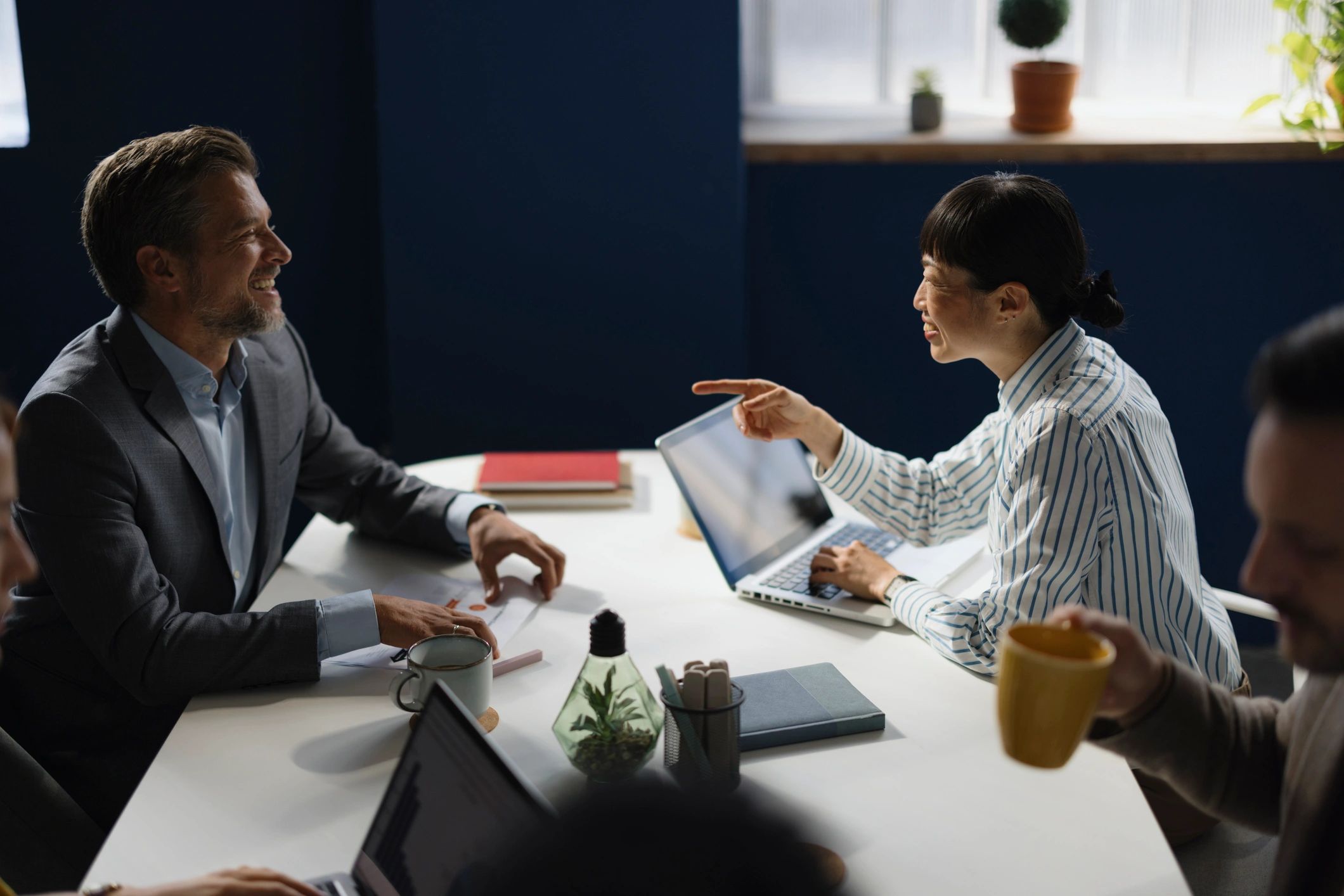 Colleagues talking during an office meeting
