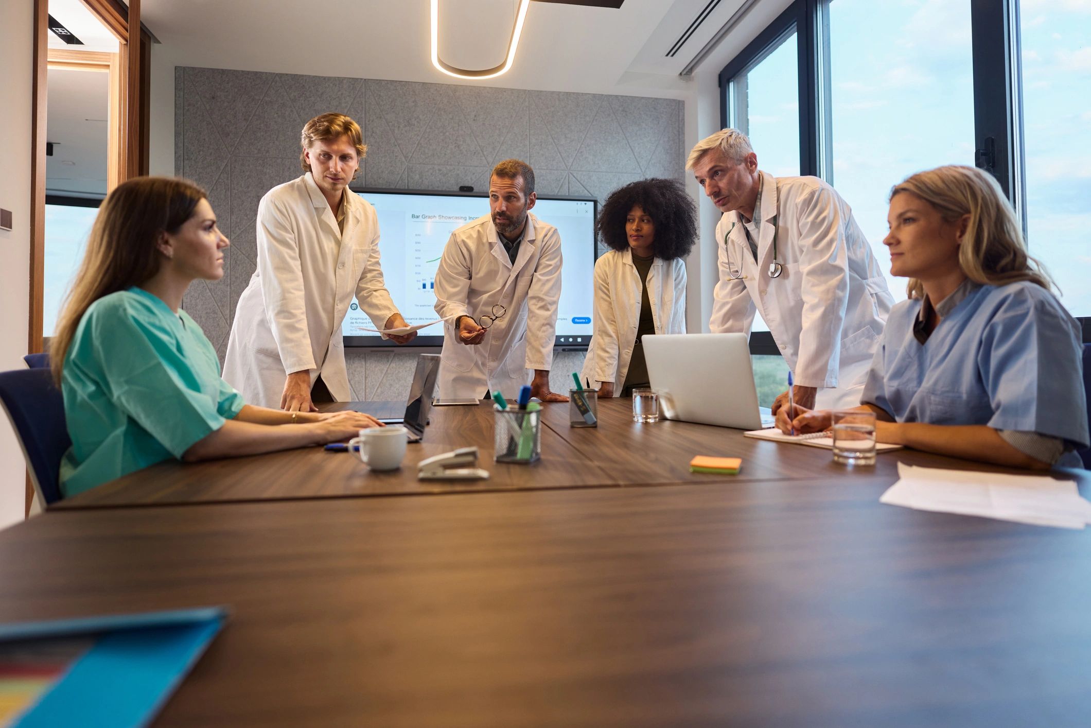 Healthcare workers in a meeting, representing workplace support and communication