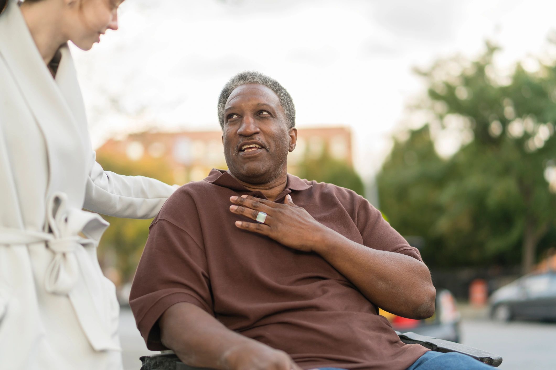 Community outreach supporting a person using a wheelchair